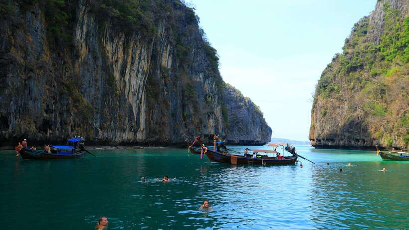 From Phi Phi: Full Day 7 Island Tour by Longtail with Sunset - Shark Point, Bamboo Island and the sunset ride