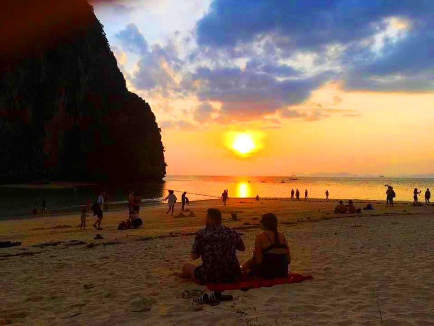 Krabi: 4 Islands Sunset Longtail Boat Tour with BBQ Dinner - Railay’s coral and the first chance to snorkel