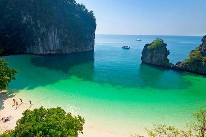 Limestone towers rising out of green water off the Krabi coast